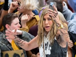 Jennifer Aniston covered in oil while filming a protest scene for Season 4 of 'The Morning Show' in Manhattan.