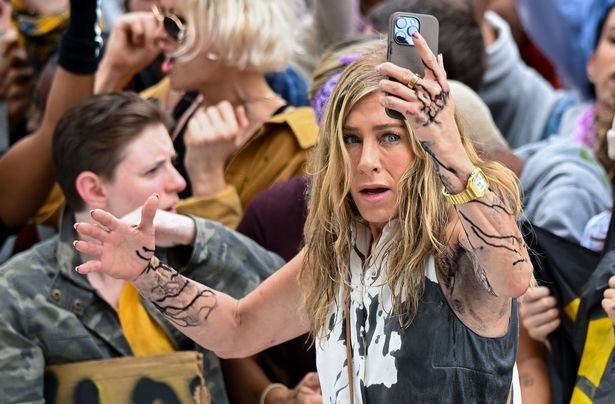 Jennifer Aniston covered in oil while filming a protest scene for Season 4 of 'The Morning Show' in Manhattan.