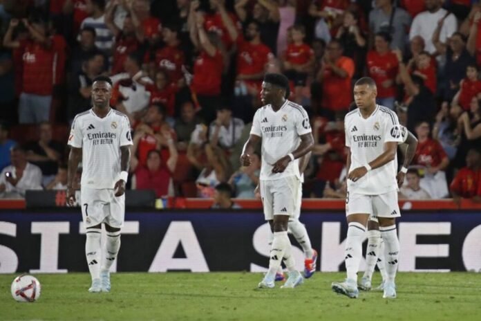 "Real Madrid players celebrate a 3-0 victory over Valladolid in La Liga 2024-25, with goals from Valverde, Brahim Diaz, and Endrick