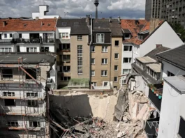 Collapsed hotel in Kröv, Germany's Mosel Valley, with rescue operations underway |whispergaze